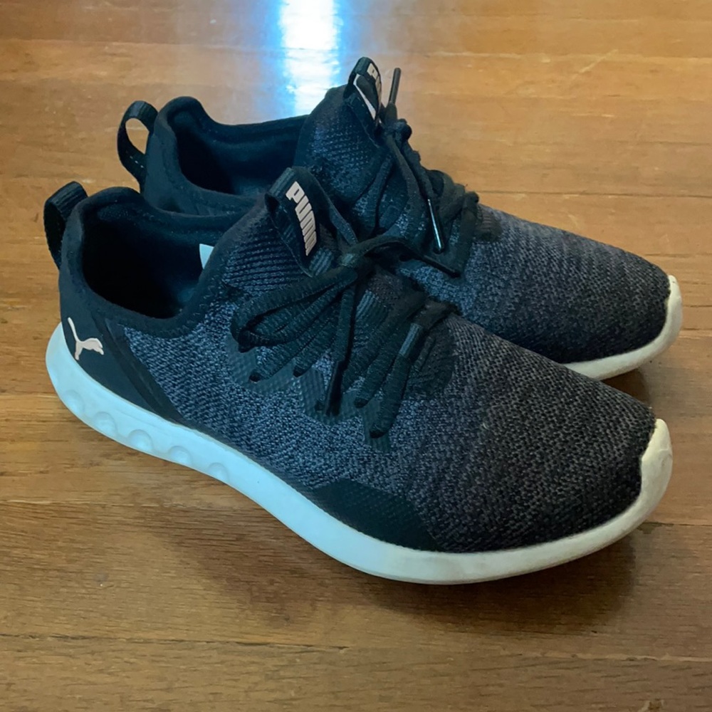 Black and grey pumas with light pink details